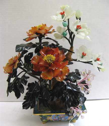 Appraisal: A CHINESE CARVED JADE TREE with flowering branches the blossoms