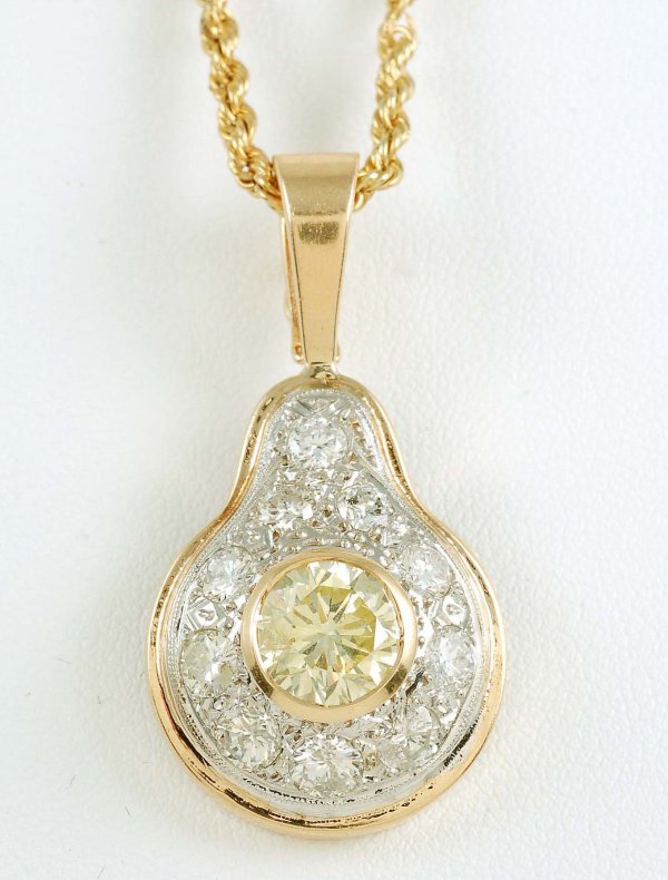 Appraisal: Yellow diamond pendant in approximately K yellow gold Center bezel