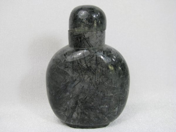 Appraisal: Chinese black white and gray rutilated quartz snuff bottle Measures