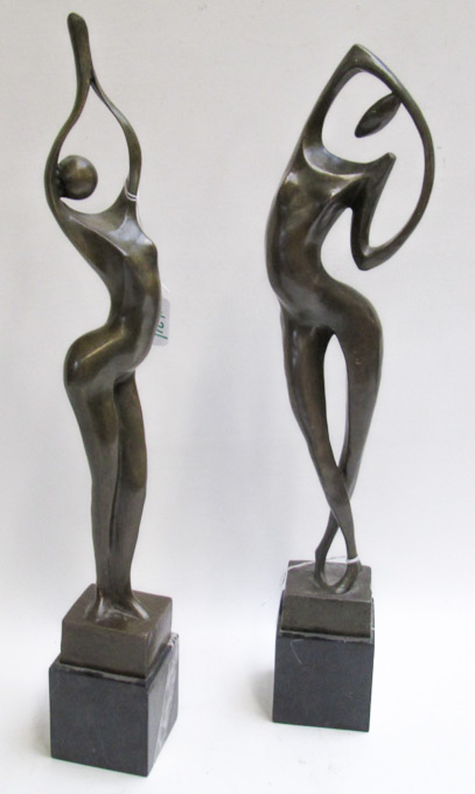 Appraisal: TWO BRONZE FIGURAL SCULPTURES stylized nude figures mounted on square