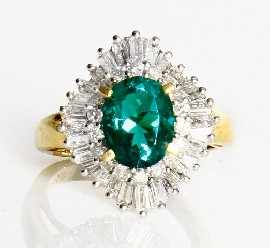 Appraisal: An ct gold green stone round brilliant and baguette cut