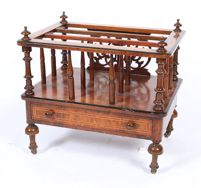 Appraisal: AN OLD WALNUT CANTERBURY with turned finials and supports above