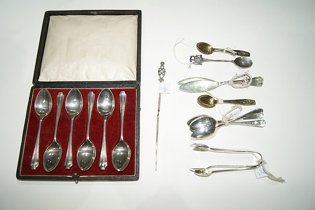 Appraisal: A CASED SET OF SILVER TEASPOONS various silver tongs butter