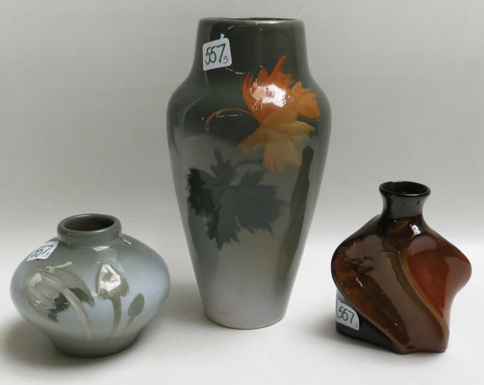 Appraisal: THREE OWENS ART POTTERY VASES Lotus vase hand decorated with