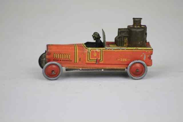 Appraisal: FIRE PUMPER PENNY TOY Fischer Germany lithographed tin features seated