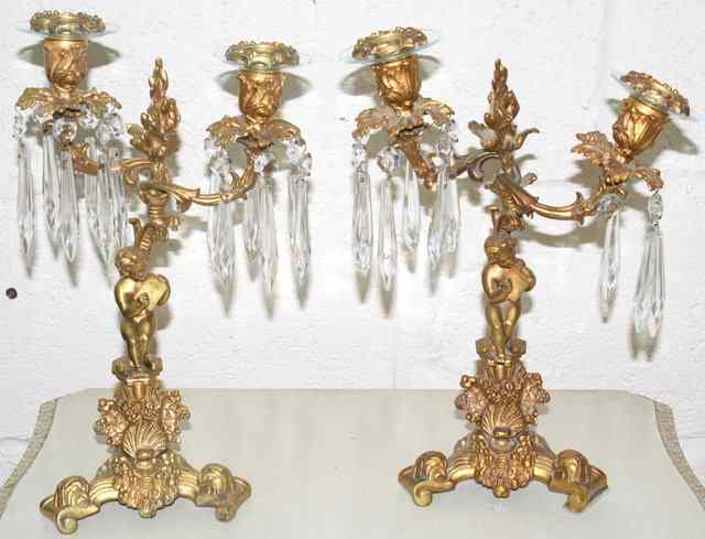 Appraisal: A PAIR OF REGENCY ORMOLU TWO BRANCH CANDELABRA with hanging