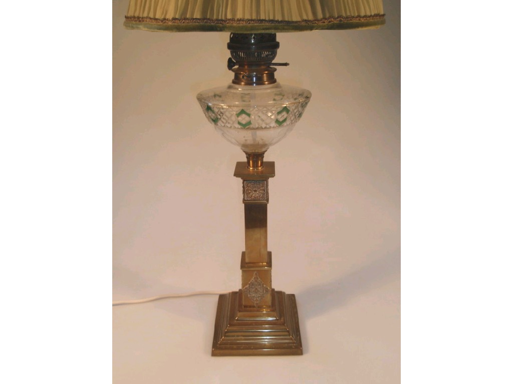 Appraisal: A gilt brass oil lamp base of stepped columnar form