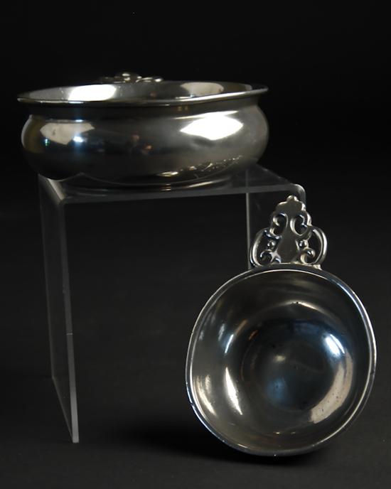 Appraisal: Two Early Pewter Porringers the larger with a pierced handle