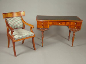 Appraisal: A pair of Regency style mahogany Trafalgar back carver dining