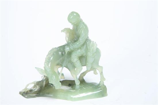 Appraisal: CARVED FIGURE Chinese th century serpentine Pale green carving of