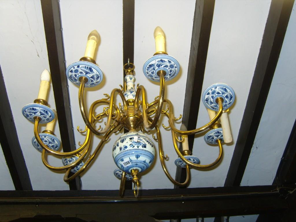 Appraisal: A Dutch style -branch brass electrolier with bulbous ceramic stem