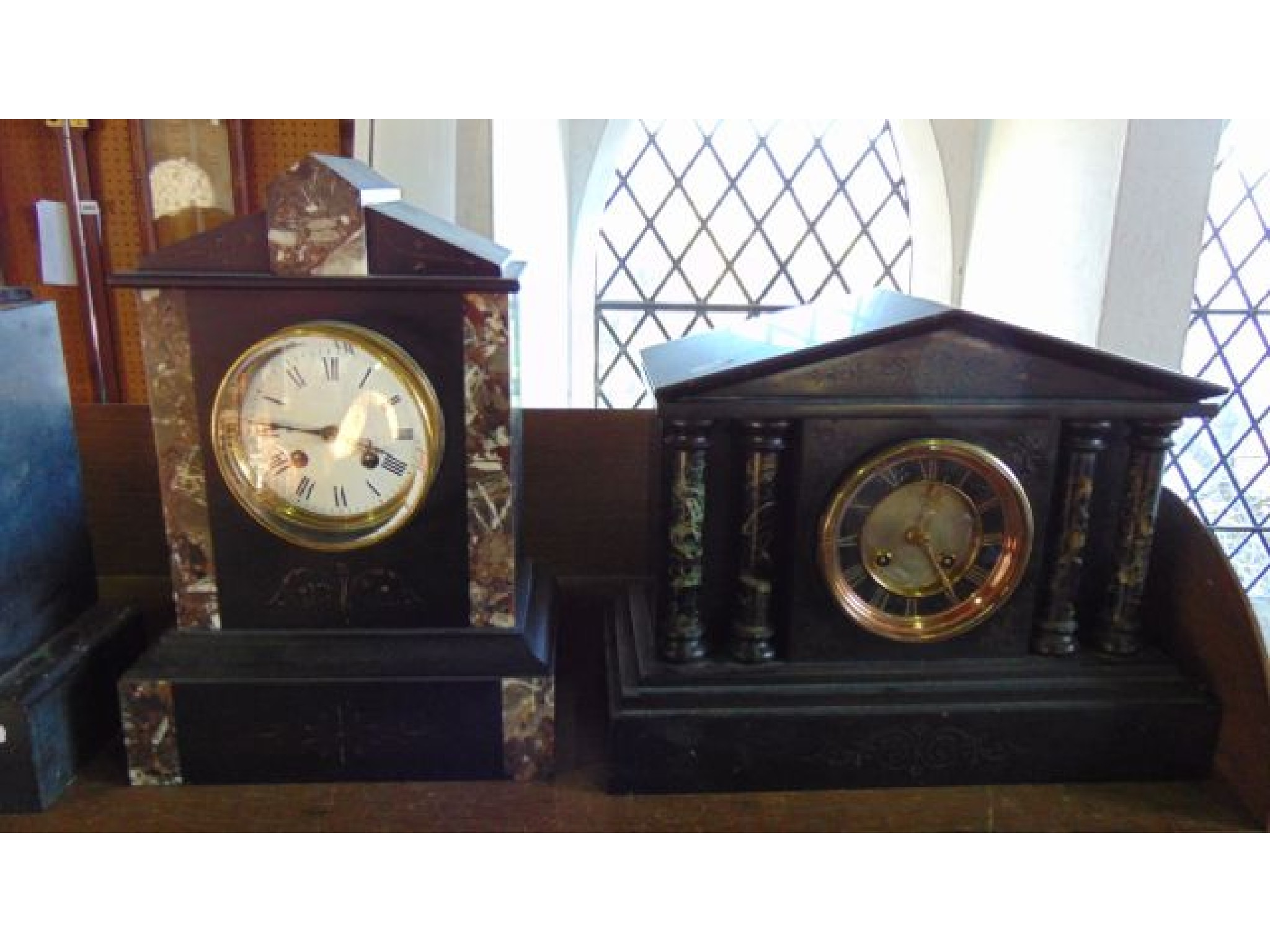 Appraisal: A Victorian black slate and marble mantle clock in the