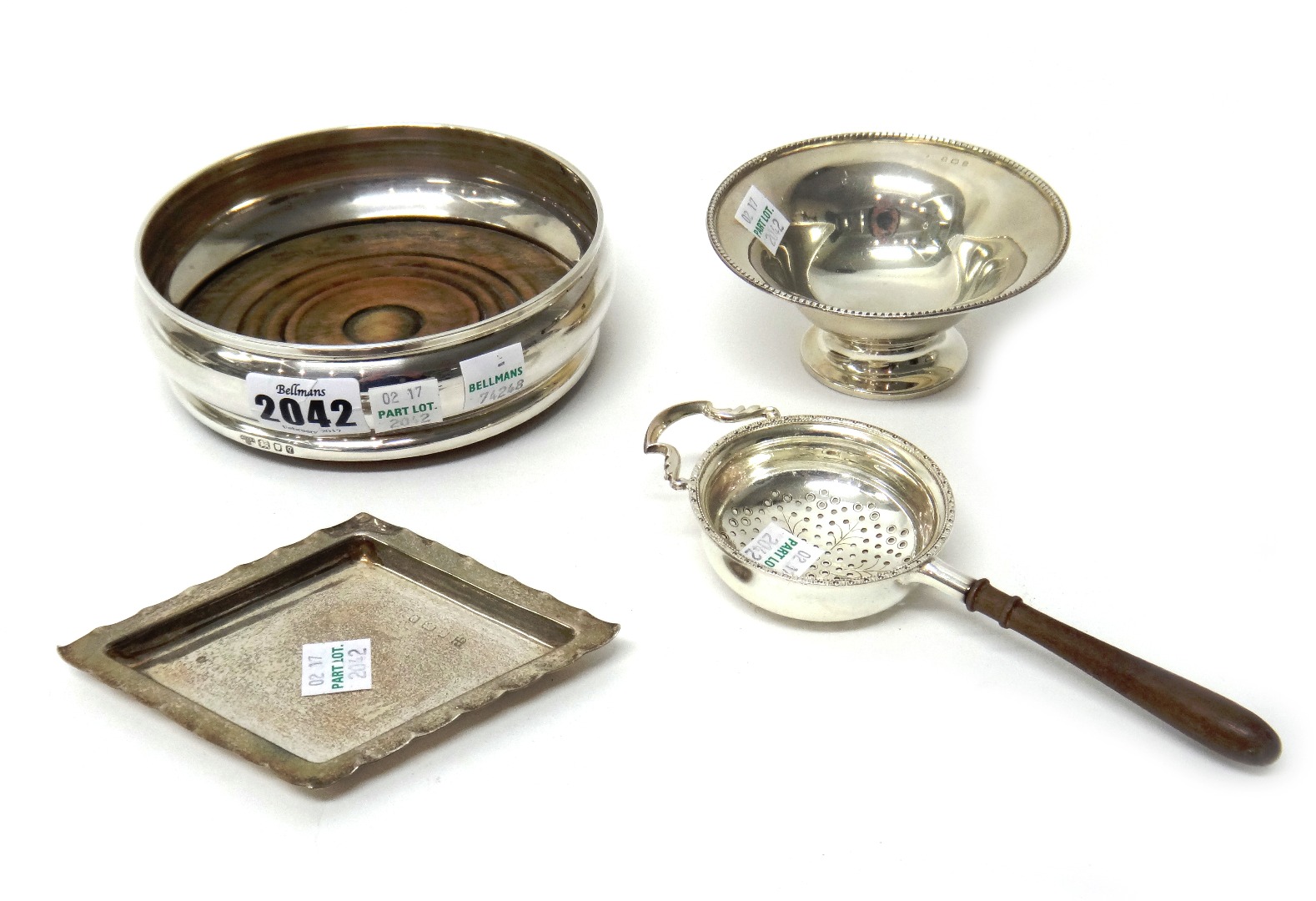 Appraisal: Silver and silver mounted wares comprising a bottle coaster having