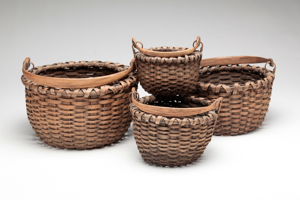 Appraisal: FOUR AMERICAN NESTING BASKETS Second half th century Woven splint