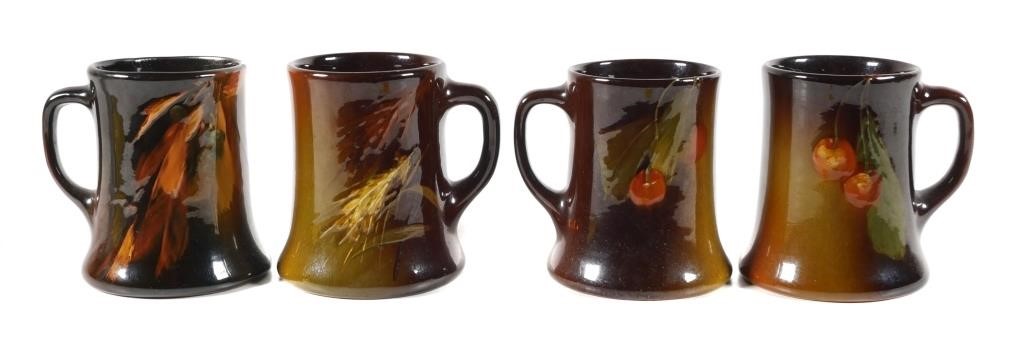 Appraisal: Four standard glaze Rozane Ware coffee mugs This item will