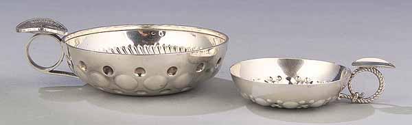 Appraisal: Two French Silver Tastevins th c in two sizes circular