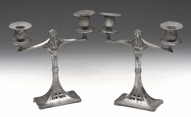 Appraisal: A pair of Secessionist German two branch pewter candelabra by