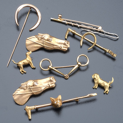 Appraisal: Nine k gold equestrian or hunt motif pins some with