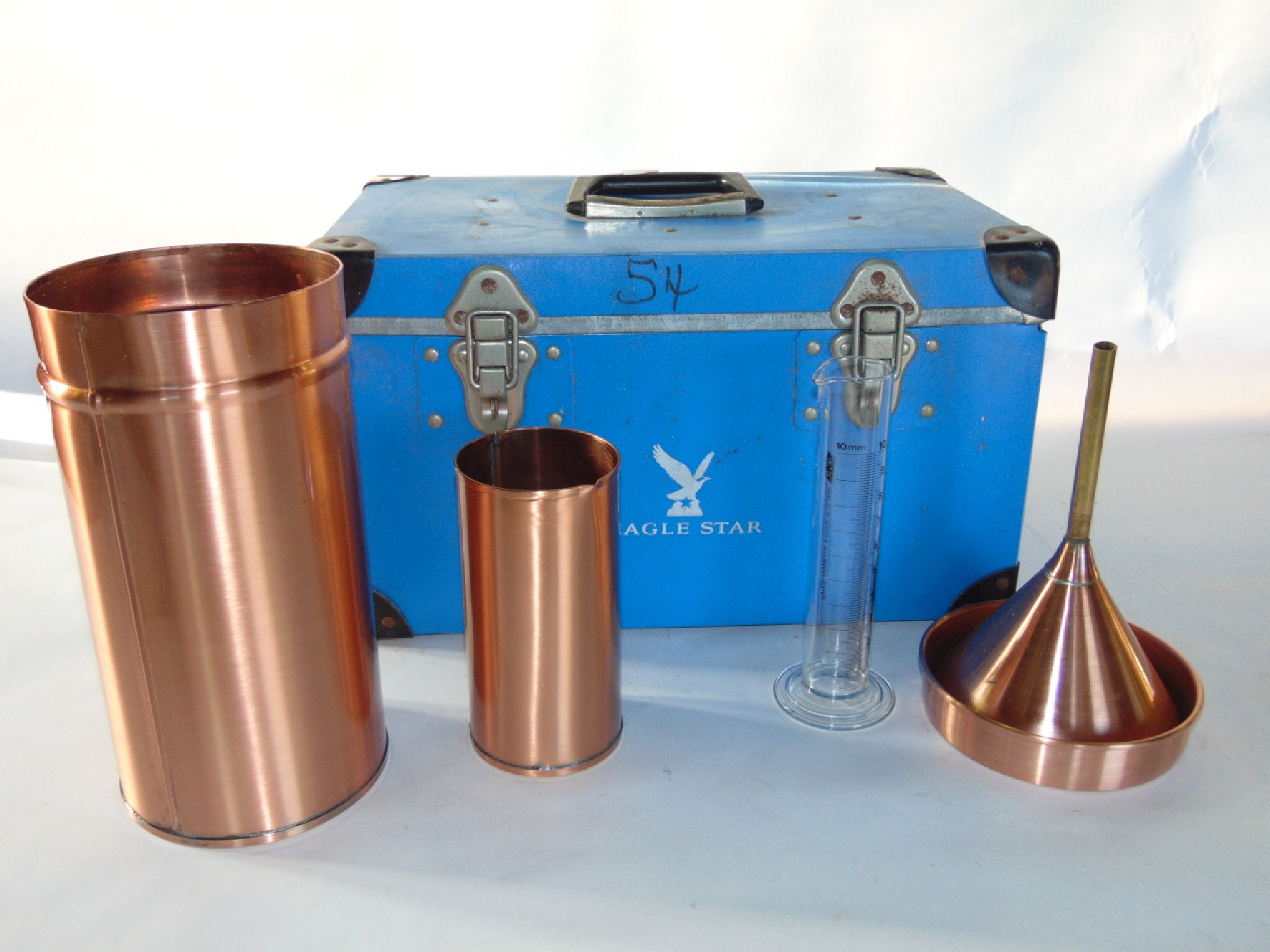 Appraisal: Cased copper laboratory equipment to include a cylindrical vessel with