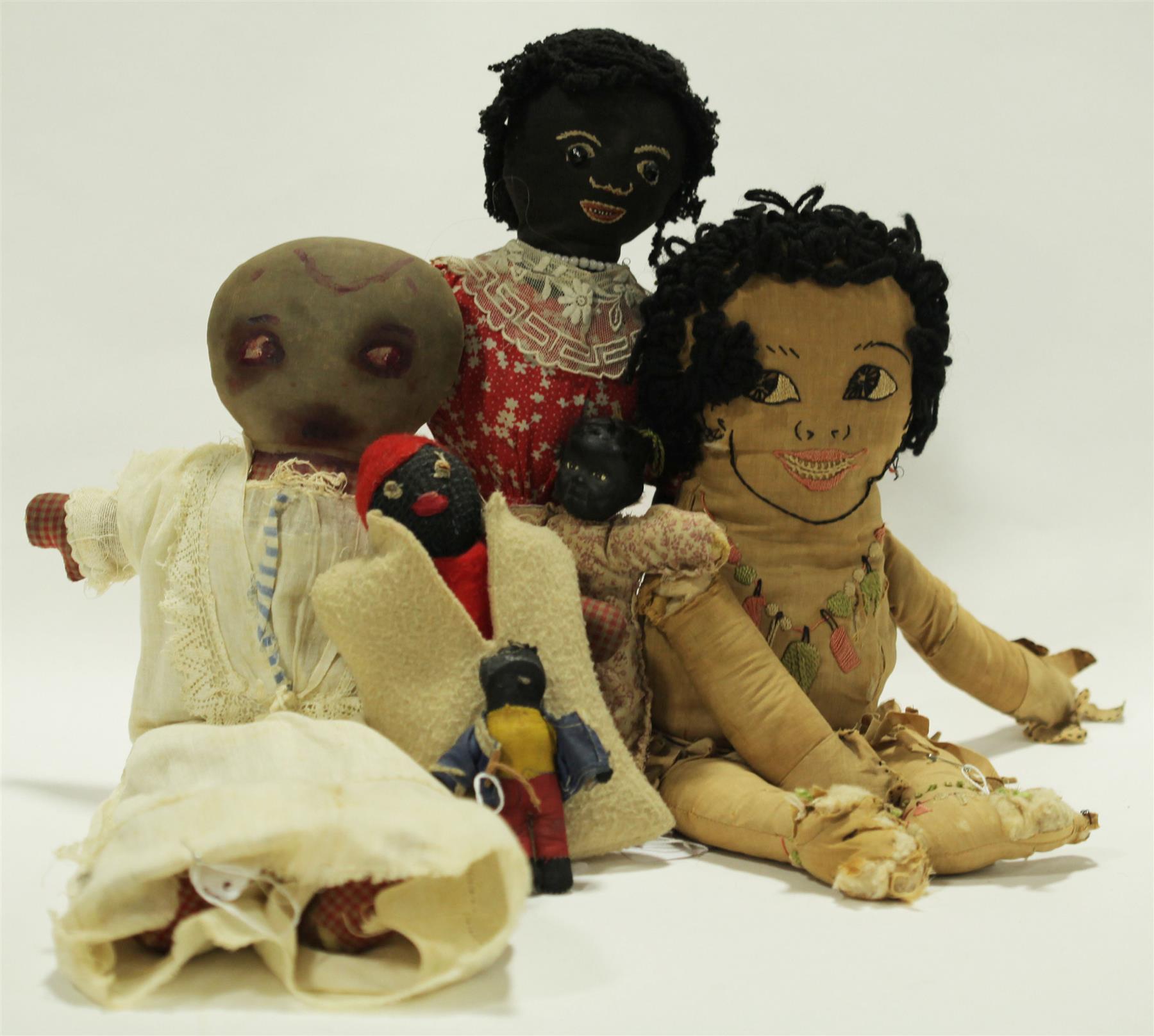 Appraisal: SIX EARLY TH CENTURY DOLLS An Indian-style doll with stitched