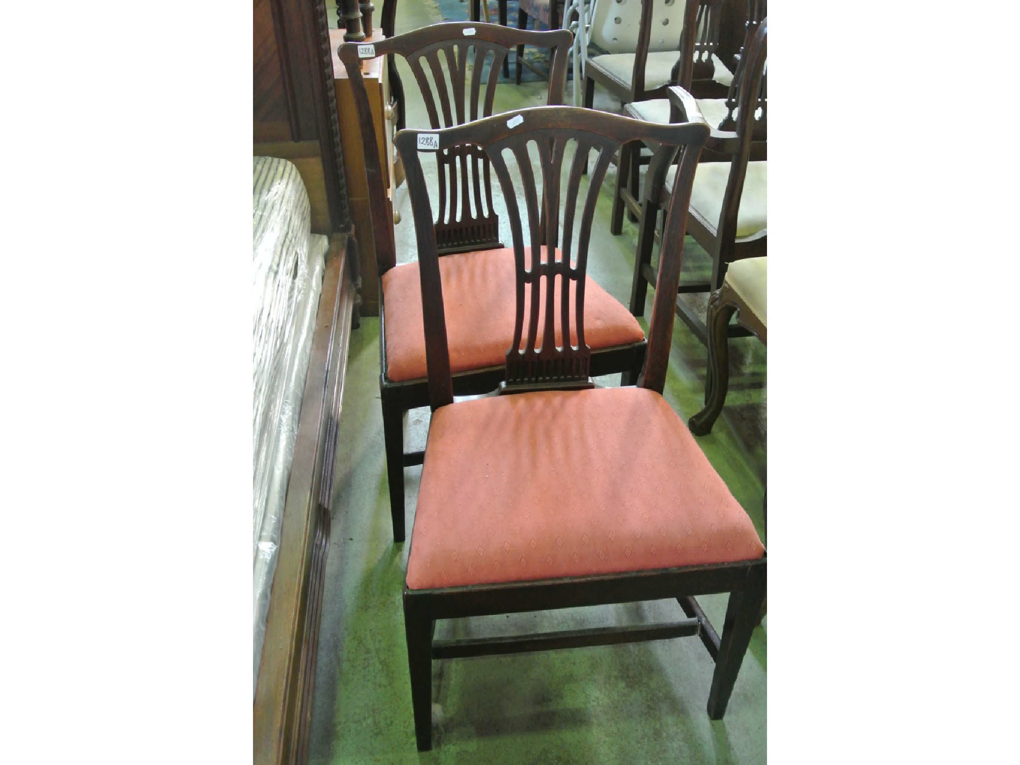 Appraisal: A pair of Georgian mahogany dining chairs in the hepplewhite