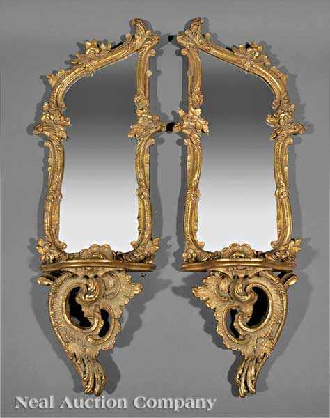 Appraisal: A Pair of Rococo-Style Carved and Gilded Mirrored Brackets each