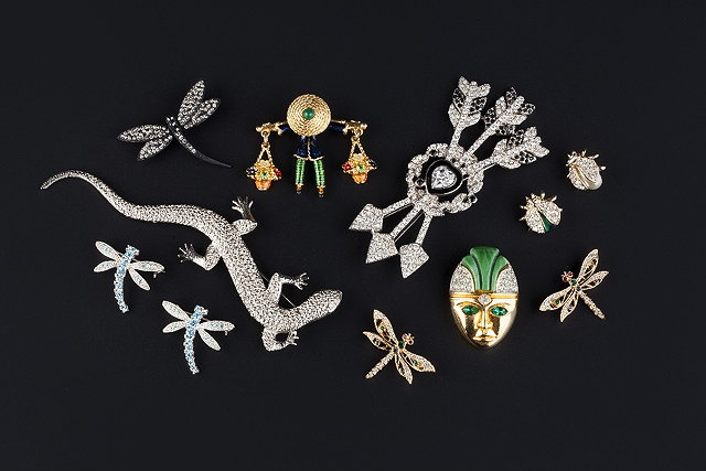 Appraisal: A collection of costume brooches comprising a paste and enamel