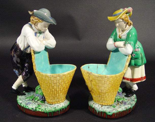 Appraisal: Pair of Minton Majolica spill vases modelled as children resting