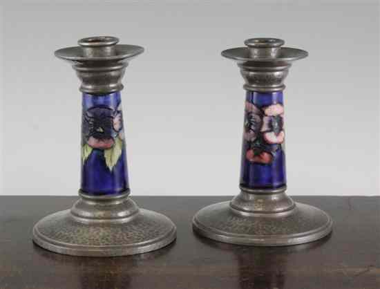 Appraisal: A pair of Liberty Tudric pewter mounted Moorcroft poppy pattern