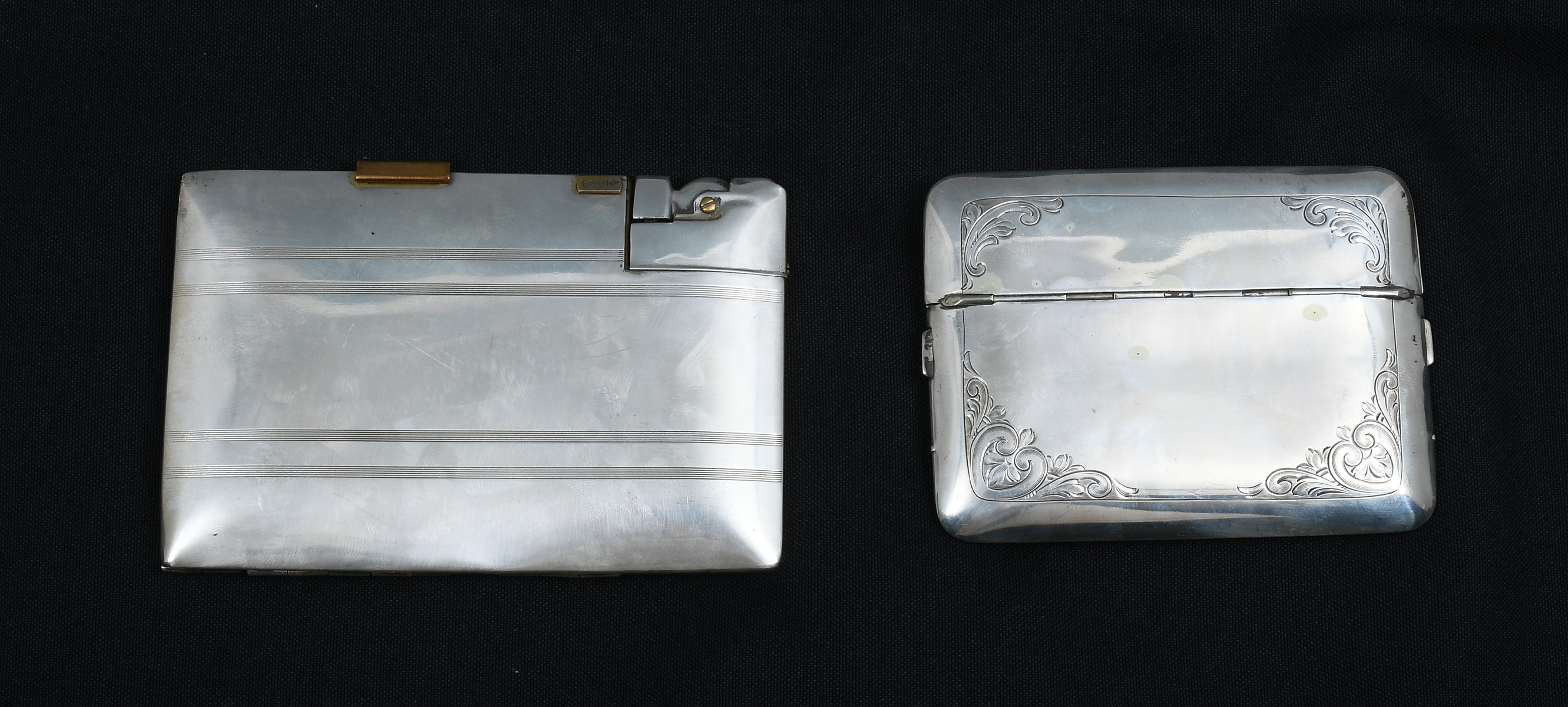 Appraisal: SILVER LIGHTER CIGARETTE CASES Comprising - Presto cigarette case with