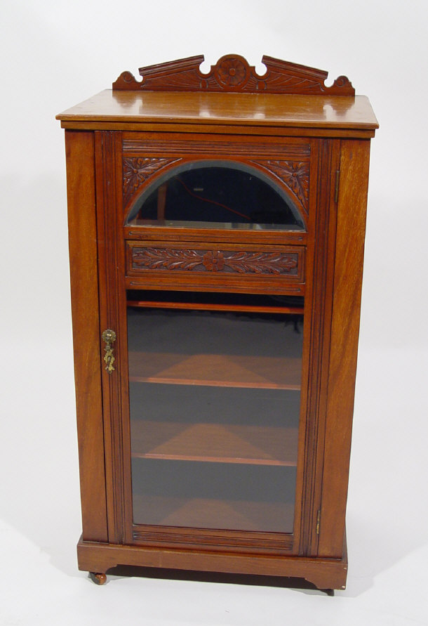 Appraisal: Victorian walnut music cabinet fitted with a mirrored and glazed