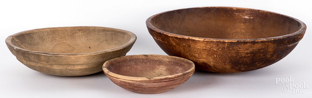 Appraisal: Three turned wood bowls th c Three turned wood bowls