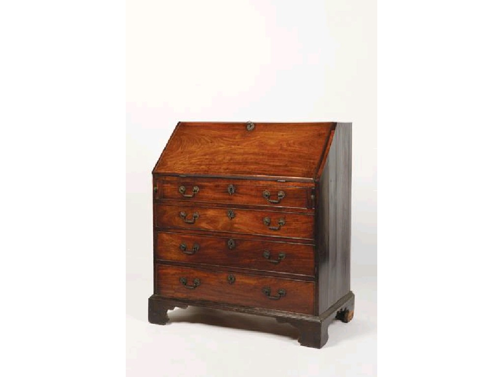 Appraisal: A GEORGE III MAHOGANY BUREAU with a fall flap enclosing