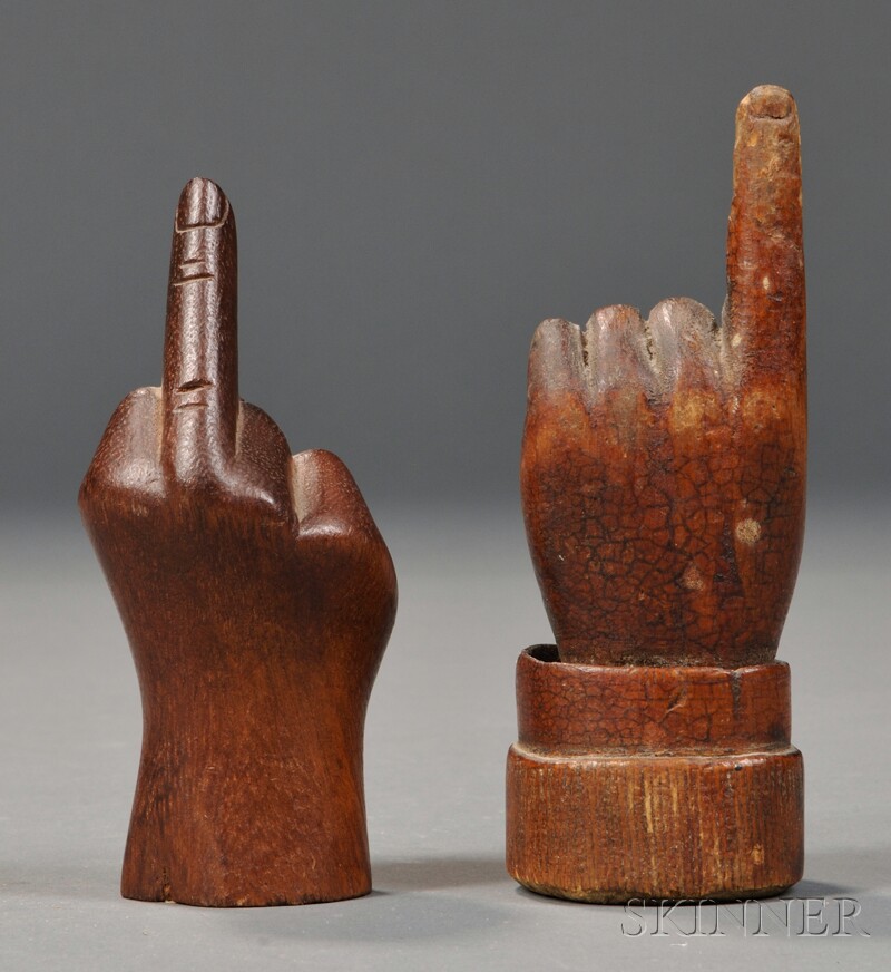 Appraisal: Two Small Carved Wooden Hands with Raised Fingers America th