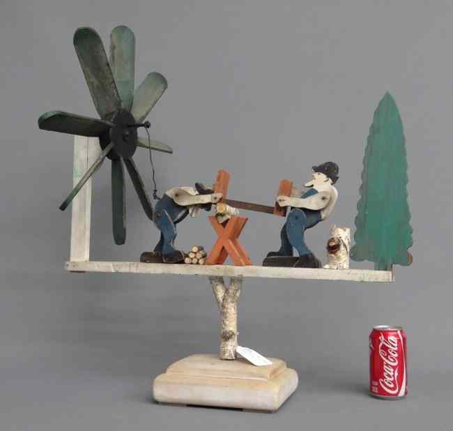 Appraisal: Folk art painted men sawing wood whirligig '' Length ''