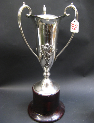 Appraisal: STERLING TROPHY THREE-HANDLED LOVING CUP raised floral design fitted on