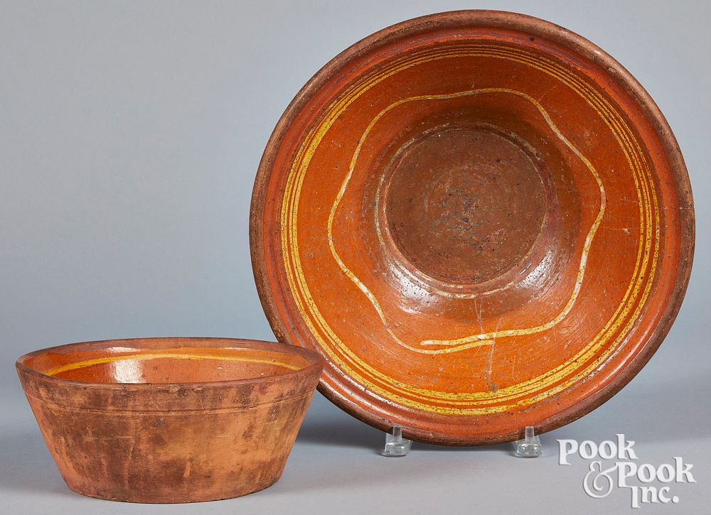 Appraisal: Two Pennsylvania slip decorated redware bowls Two Pennsylvania slip decorated