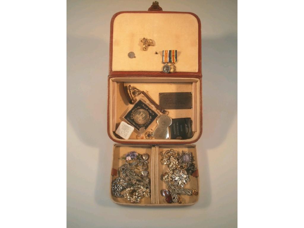 Appraisal: A tan leather jewellery box and contents of mainly costume