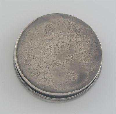 Appraisal: A Queen Anne circular armorial snuff box with moulded borders