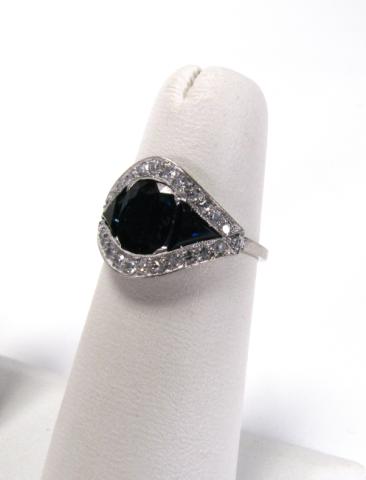 Appraisal: Platinum sapphire and diamond lady's ring with two trillion cut