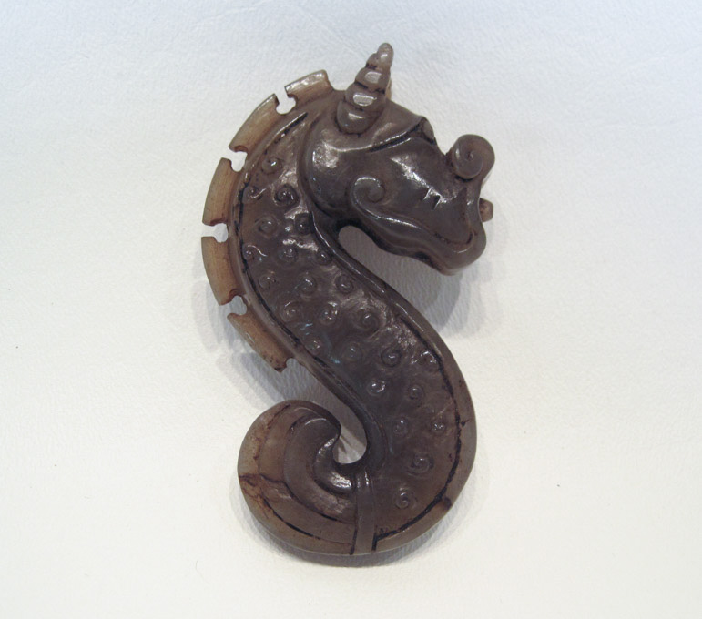 Appraisal: CHINESE JADE CARVING a stylized dragon-like seahorse S-curved - length