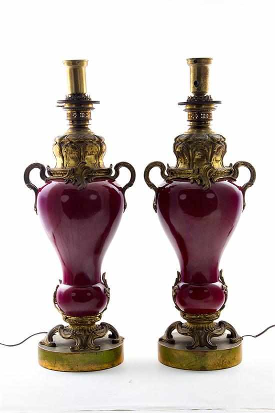 Appraisal: Pair French ormolu-mounted sang de boeuf porcelain oil lamps th