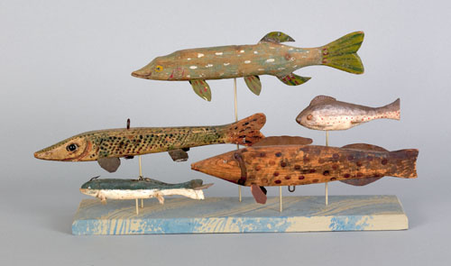 Appraisal: Five fish decoys th c mounted to a wood platform