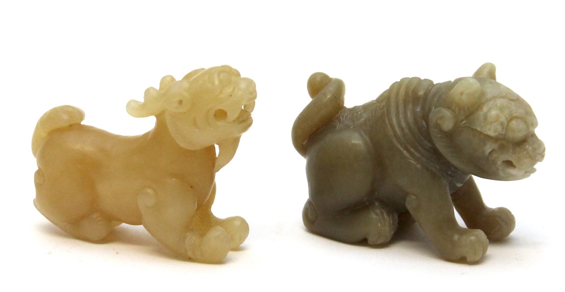 Appraisal: Two small jade and pierced mythical beasts th th century