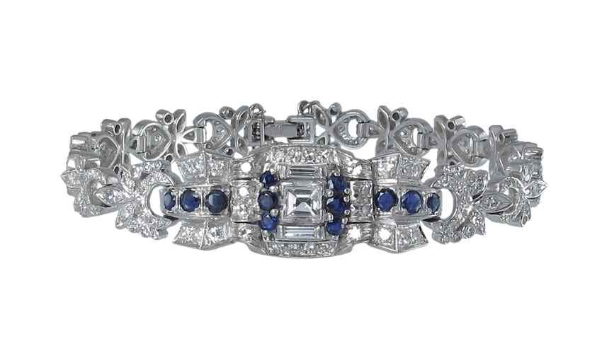 Appraisal: PLATINUM DIAMOND AND SAPPHIRE BRACELET At the center is a