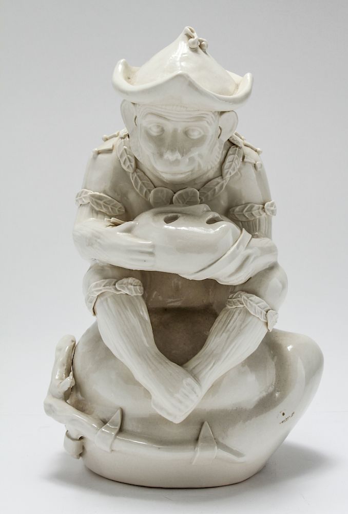 Appraisal: Porcelain Sculpture of Monkey with Mask White porcelain sculpture depicting