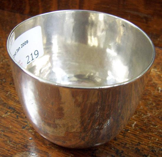 Appraisal: A Queen Anne tumbler cup the bowl slightly hammered the