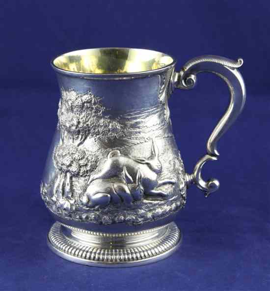 Appraisal: A George II silver mug with later embossed decoration of