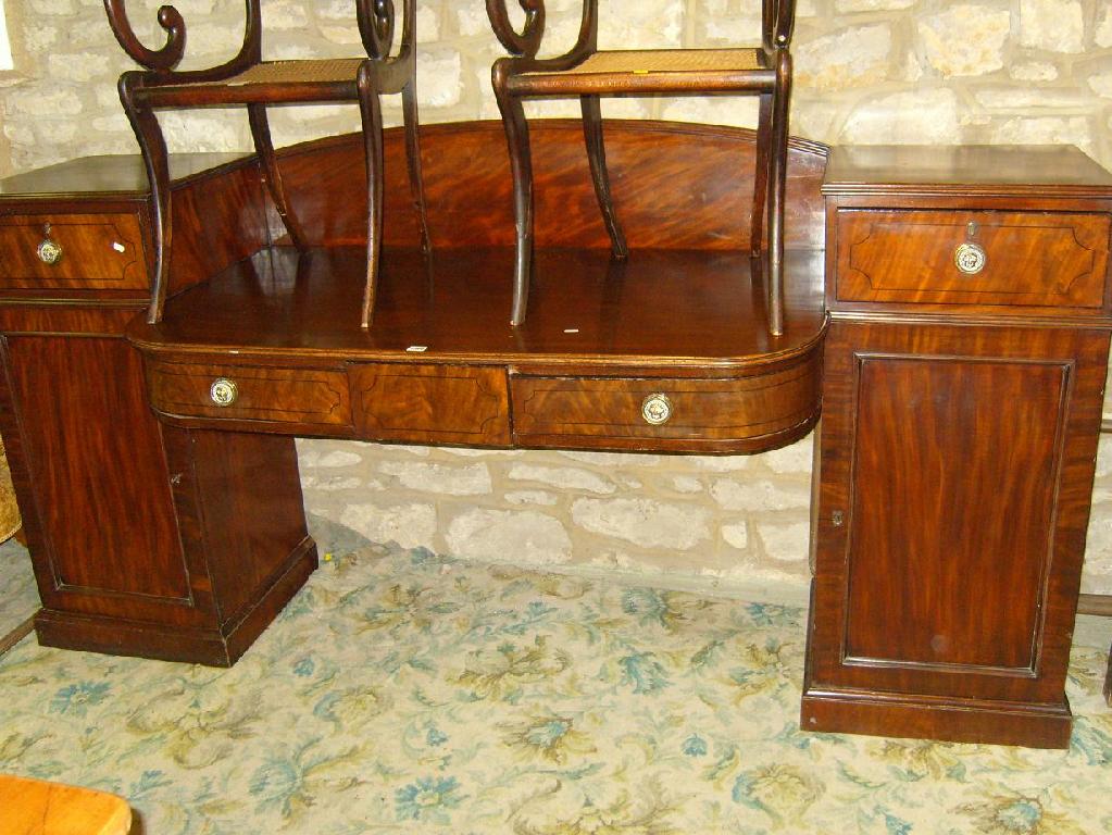 Appraisal: A Regency mahogany twin pedestal breakfront sideboard each pedestal fitted