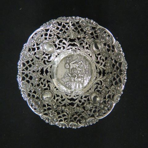 Appraisal: Continental Silver Dish with Childrenat play fine elaborate openwork diameter